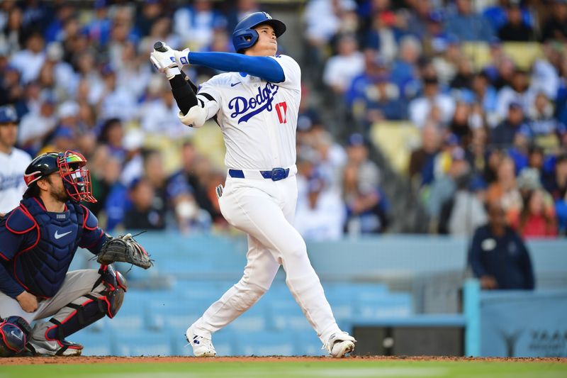 May 4, 2024; Los Angeles, California, USA; Los Angeles Dodgers designated hitter Shohei Ohtani (17) hits a solo home run against the Atlanta Braves during the third inning at Dodger Stadium. Mandatory Credit: Gary A. Vasquez-USA TODAY Sports