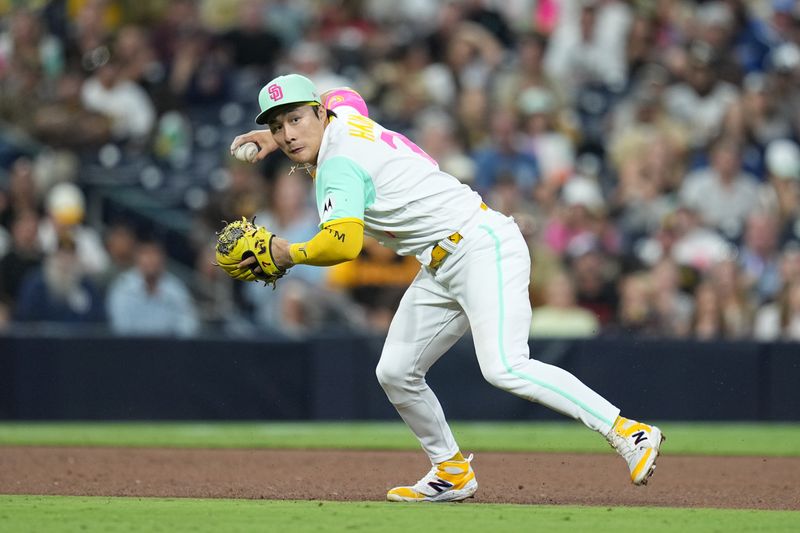 Aug 18, 2023; San Diego, California, USA;  San Diego Padres third baseman Ha-Seong Kim (7) fields a ground ball hit by Arizona Diamondbacks first baseman Christian Walker (not pictured) during the eighth inning at Petco Park. Mandatory Credit: Ray Acevedo-USA TODAY Sports