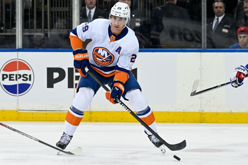 Apr 13, 2024; New York, New York, USA;  New York Islanders center Brock Nelson (29) looks for a pass against the New York Rangers during the first period at Madison Square Garden. Mandatory Credit: Dennis Schneidler-USA TODAY Sports