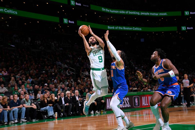 BOSTON, MA - APRIL 11: Derrick White #9 of the Boston Celtics drives to the basket during the game against the New York Knicks on April 11, 2024 at the TD Garden in Boston, Massachusetts. NOTE TO USER: User expressly acknowledges and agrees that, by downloading and or using this photograph, User is consenting to the terms and conditions of the Getty Images License Agreement. Mandatory Copyright Notice: Copyright 2024 NBAE  (Photo by Brian Babineau/NBAE via Getty Images)