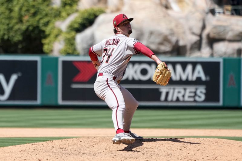 Jul 2, 2023; Anaheim, California, USA; Arizona Diamondbacks relief pitcher Kyle Nelson (24) throws in the eighth inning against the Los Angeles Angels at Angel Stadium. Mandatory Credit: Kirby Lee-USA TODAY Sports