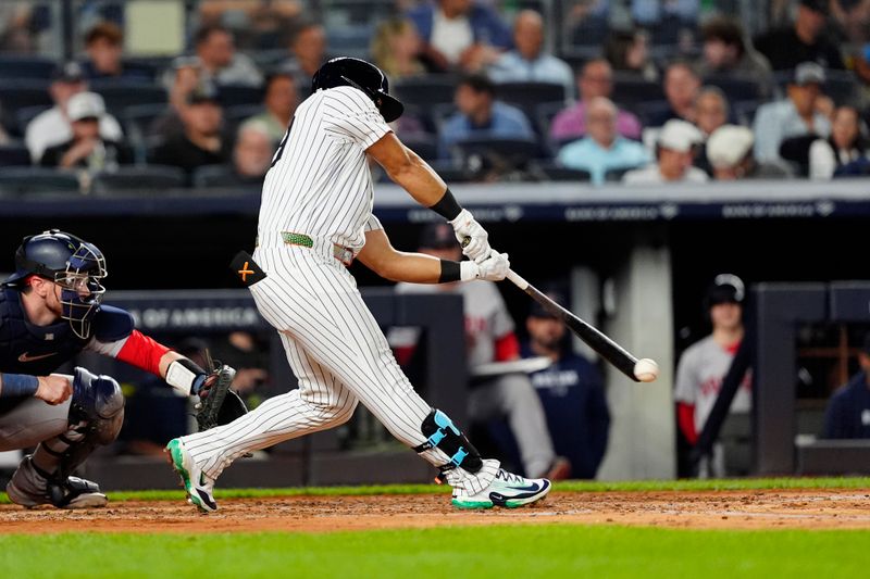 Sep 12, 2024; Bronx, New York, USA; New York Yankees left fielder Jasson Dominguez (89) hits a single against the Boston Red Sox during the second inning at Yankee Stadium. Mandatory Credit: Gregory Fisher-Imagn Images