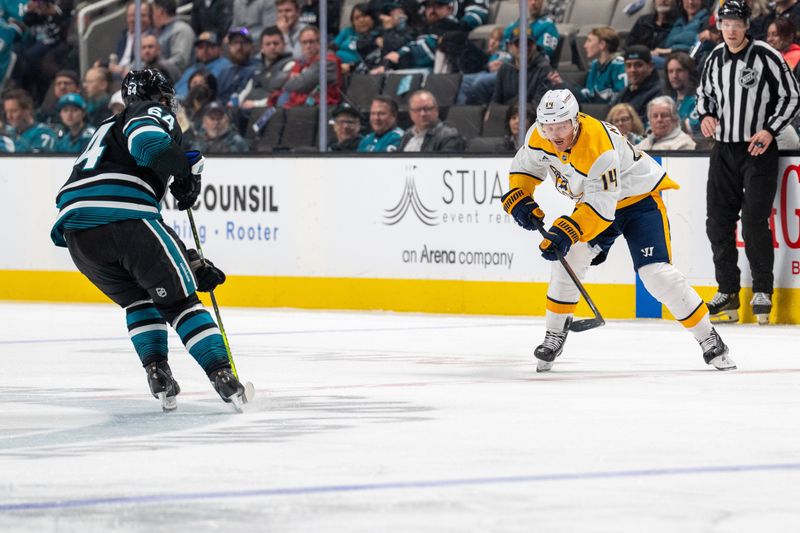 Jan 23, 2025; San Jose, California, USA;  Nashville Predators center Gustav Nyquist (14) flicks the pass forward against the San Jose Sharks during the third period at SAP Center at San Jose. Mandatory Credit: Neville E. Guard-Imagn Images