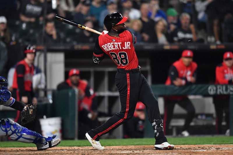 Jun 6, 2025; Chicago, Illinois, USA; Chicago White Sox center fielder Luis Robert Jr. (88) hits a two-run single during the eighth inning against the Kansas City Royals at Rate Field. Mandatory Credit: Patrick Gorski-Imagn Images