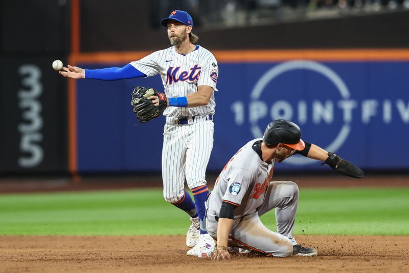 Aug 20, 2024; New York City, New York, USA;  New York Mets second baseman Jeff McNeil (1) throws past Baltimore Orioles left fielder Austin Slater (15) attempting to complete a double play in the third inning at Citi Field. Mandatory Credit: Wendell Cruz-USA TODAY Sports