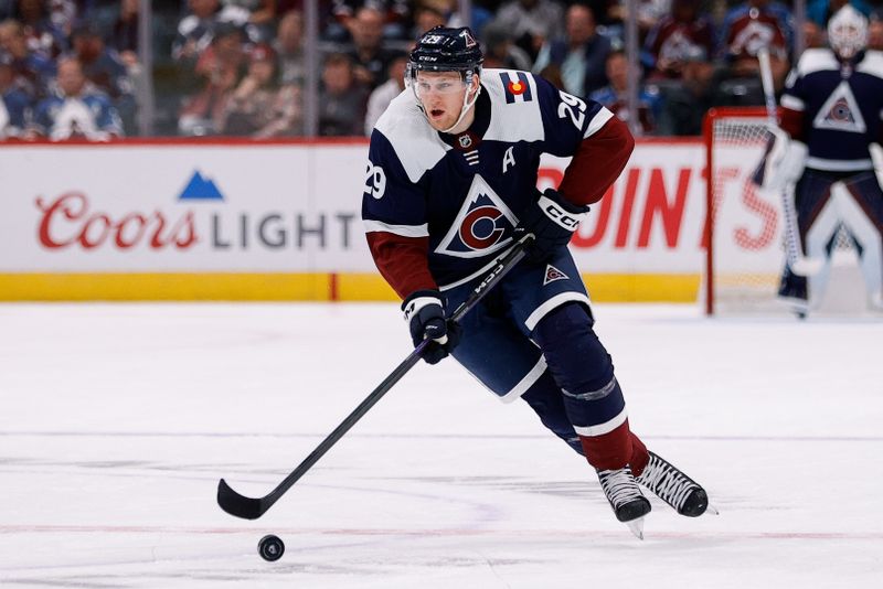 Nov 10, 2022; Denver, Colorado, USA; Colorado Avalanche center Nathan MacKinnon (29) controls the puck in the second period against the Nashville Predators at Ball Arena. Mandatory Credit: Isaiah J. Downing-USA TODAY Sports