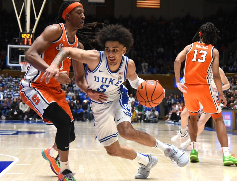 Jan 2, 2024; Durham, North Carolina, USA; Duke Blue Devils guard Tyrese Proctor (5) drives to the basket as Syracuse Orange forward Maliq Brown (1) defends during the second half at Cameron Indoor Stadium.  The Blue Devils won 86-66. Mandatory Credit: Rob Kinnan-USA TODAY Sports