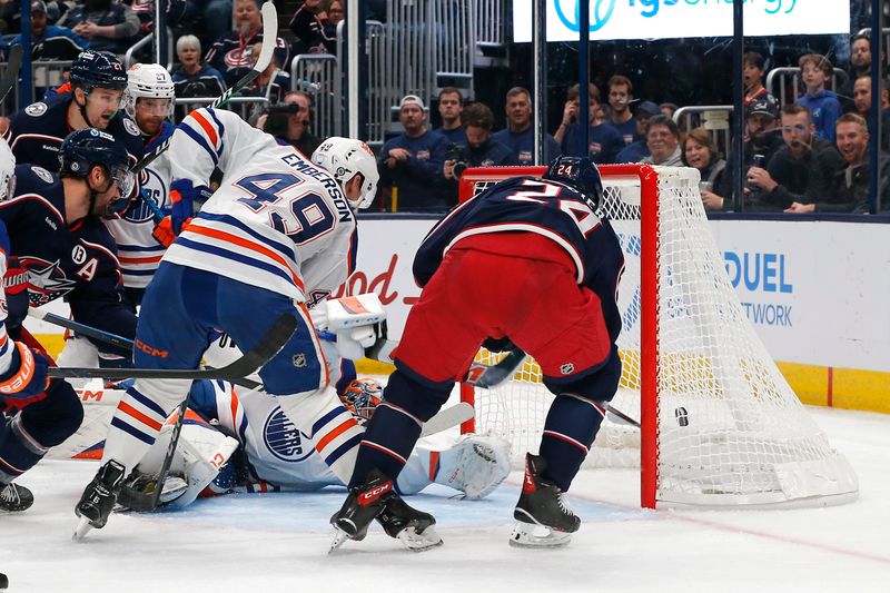 Oct 28, 2024; Columbus, Ohio, USA; Columbus Blue Jackets center Mathieu Olivier (24) scores a goal off the rebound of a Edmonton Oilers goalie Stuart Skinner (74) save during the second period at Nationwide Arena. Mandatory Credit: Russell LaBounty-Imagn Images