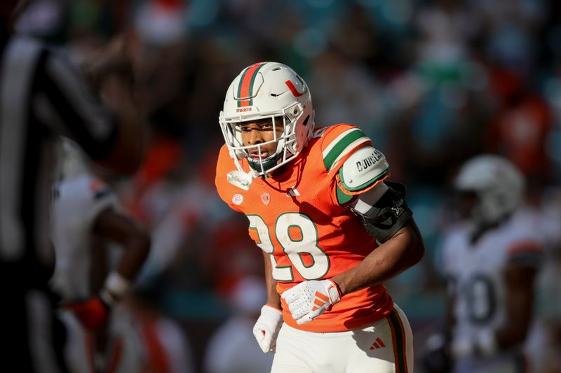 Oct 28, 2023; Miami Gardens, Florida, USA; Miami Hurricanes running back Ajay Allen (28) looks on after scoring a touchdown against the Virginia Cavaliers during the third quarter at Hard Rock Stadium. Mandatory Credit: Sam Navarro-USA TODAY Sports