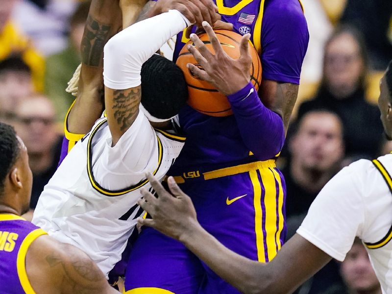 Feb 1, 2023; Columbia, Missouri, USA; LSU Tigers forward Derek Fountain (20) grabs a loose ball from Missouri Tigers guard Isiaih Mosley (11) during the second half at Mizzou Arena. Mandatory Credit: Jay Biggerstaff-USA TODAY Sports