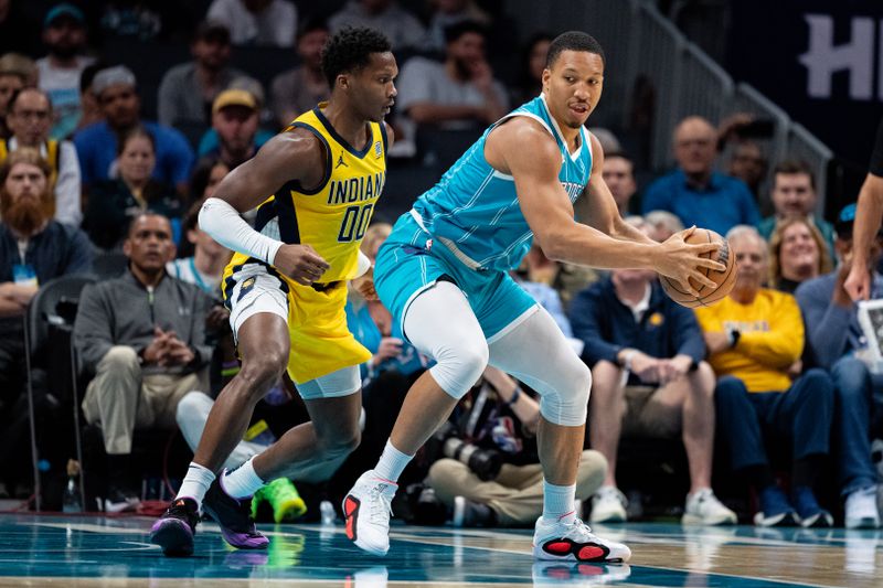 CHARLOTTE, NORTH CAROLINA - NOVEMBER 08: Bennedict Mathurin #00 of the Indiana Pacers guards Grant Williams #2 of the Charlotte Hornets in the first quarter during their game at Spectrum Center on November 08, 2024 in Charlotte, North Carolina. NOTE TO USER: User expressly acknowledges and agrees that, by downloading and or using this photograph, User is consenting to the terms and conditions of the Getty Images License Agreement. (Photo by Jacob Kupferman/Getty Images)