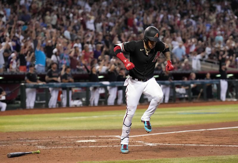 Aug 26, 2023; Phoenix, Arizona, USA; Arizona Diamondbacks second baseman Ketel Marte (4) flexes after hitting a three run home run against the Cincinnati Reds during the fifth inning at Chase Field. Mandatory Credit: Joe Camporeale-USA TODAY Sports