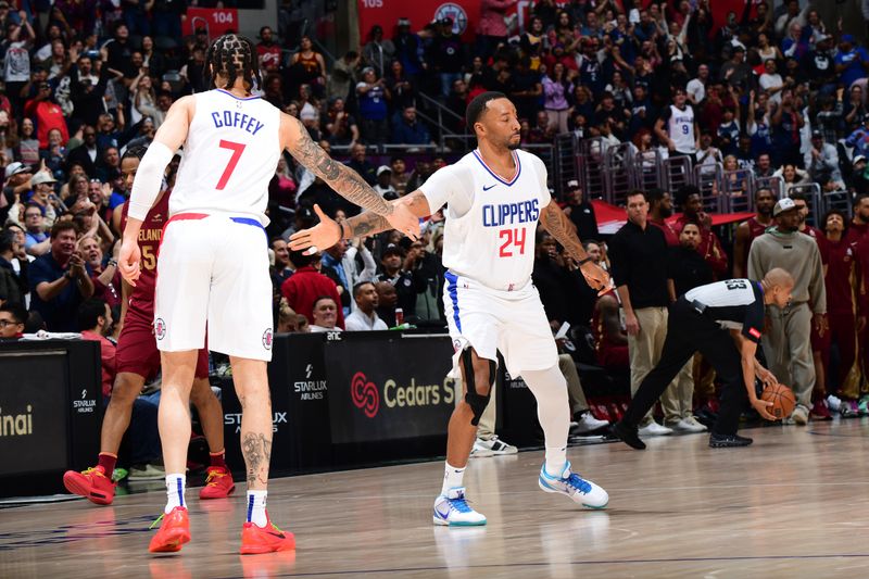 LOS ANGELES, CA - APRIL 7: Amir Coffey #7 of the LA Clippers and Norman Powell #24 of the LA Clippers high five during the game against the Cleveland Cavaliers on April 7, 2024 at Crypto.Com Arena in Los Angeles, California. NOTE TO USER: User expressly acknowledges and agrees that, by downloading and/or using this Photograph, user is consenting to the terms and conditions of the Getty Images License Agreement. Mandatory Copyright Notice: Copyright 2024 NBAE (Photo by Adam Pantozzi/NBAE via Getty Images)