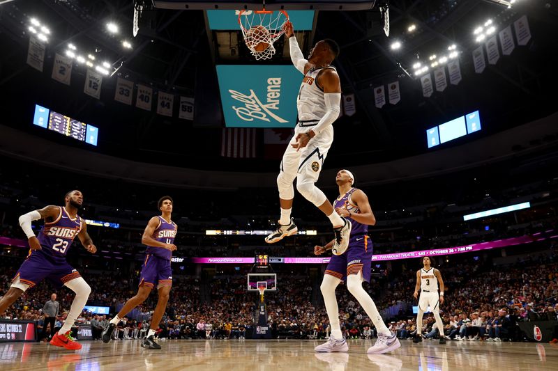 DENVER, COLORADO - OCTOBER 13: Russell Westbrook #4 of the Denver Nuggets dunks against the Phoenix Suns at Ball Arena on October 13, 2024 in Denver, Colorado. NOTE TO USER: User expressly acknowledges and agrees that, by downloading and/or using this Photograph, user is consenting to the terms and conditions of the Getty Images License Agreement. (Photo by Jamie Schwaberow/Getty Images)