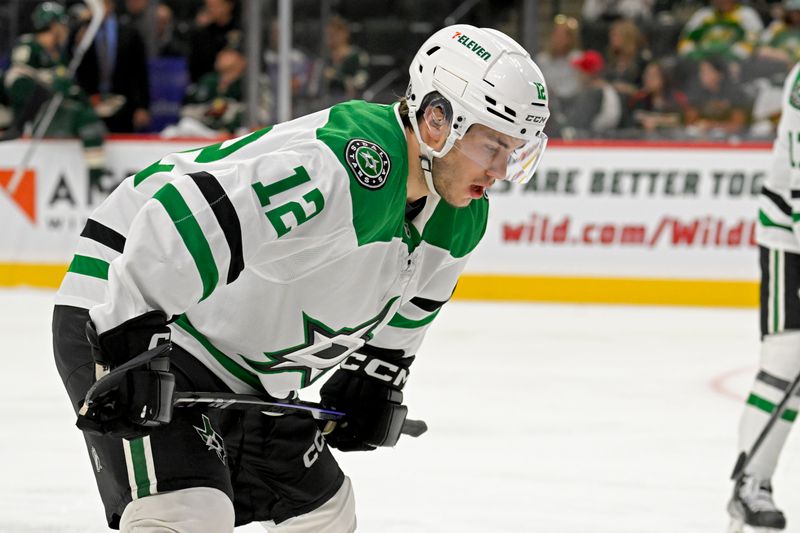 Sep 29, 2024; Saint Paul, Minnesota, USA;  Dallas Stars forward Arttu Hyry (12) lines up for a face-off against the Minnesota Wild during the first period at Xcel Energy Center. Mandatory Credit: Nick Wosika-Imagn Images