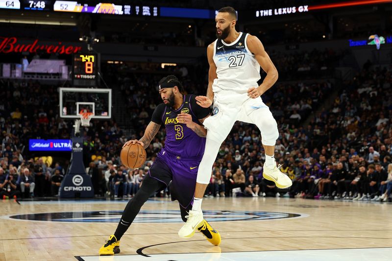 MINNEAPOLIS, MINNESOTA - DECEMBER 02: Anthony Davis #3 of the Los Angeles Lakers drives to the basket against Rudy Gobert #27 of the Minnesota Timberwolves in the third quarter at Target Center on December 02, 2024 in Minneapolis, Minnesota. The Timberwolves defeated the Lakers 109-80. NOTE TO USER: User expressly acknowledges and agrees that, by downloading and or using this photograph, User is consenting to the terms and conditions of the Getty Images License Agreement. (Photo by David Berding/Getty Images)