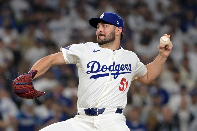 Oct 11, 2024; Los Angeles, California, USA; Los Angeles Dodgers pitcher Alex Vesia (51) pitches in the seventh inning  against the San Diego Padres during game five of the NLDS for the 2024 MLB Playoffs at Dodger Stadium. Mandatory Credit: Jayne Kamin-Oncea-Imagn Images