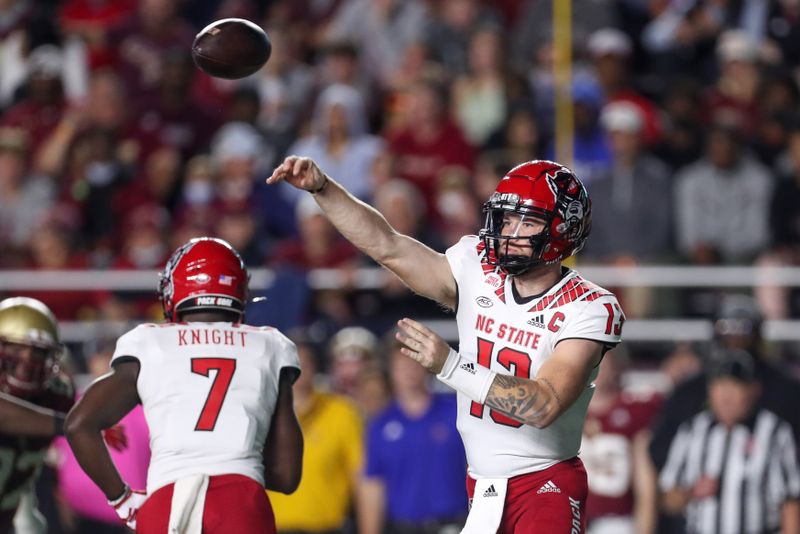 Oct 16, 2021; Chestnut Hill, Massachusetts, USA; North Carolina State Wolfpack quarterback Devin Leary (13) passes the ball during the first half against the Boston College Eagles at Alumni Stadium. Mandatory Credit: Paul Rutherford-USA TODAY Sports