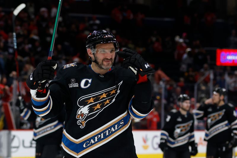 Jan 18, 2025; Washington, District of Columbia, USA; Washington Capitals left wing Alex Ovechkin (8) gestures to his son in the stands (not pictured) after the Capitals' game against the Pittsburgh Penguins at Capital One Arena. Mandatory Credit: Geoff Burke-Imagn Images