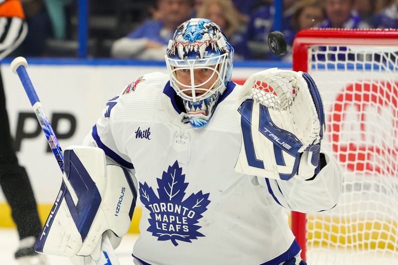 Oct 21, 2023; Tampa, Florida, USA;  Toronto Maple Leafs goaltender Ilya Samsonov (35) blocks a shot against the Tampa Bay Lightning in the first period at Amalie Arena. Mandatory Credit: Nathan Ray Seebeck-USA TODAY Sports