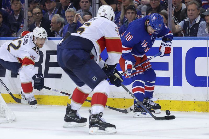 May 22, 2024; New York, New York, USA; New York Rangers left wing Artemi Panarin (10) fights for the puck against Florida Panthers defenseman Gustav Forsling (42) and center Aleksander Barkov (16) during the third period of game one of the Eastern Conference Final of the 2024 Stanley Cup Playoffs at Madison Square Garden. Mandatory Credit: Brad Penner-USA TODAY Sports