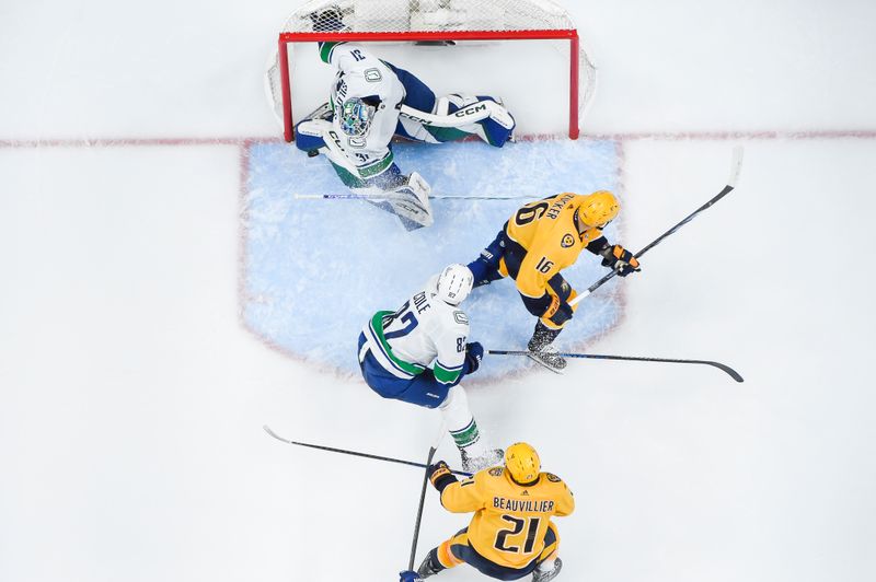 May 3, 2024; Nashville, Tennessee, USA; Vancouver Canucks goalkeeper Vancouver Canucks goalie Arturs Silovs (31) blocks the shot of Nashville Predators left wing Anthony Beauvillier (21) during the second period in game six of the first round of the 2024 Stanley Cup Playoffs at Bridgestone Arena. Mandatory Credit: Steve Roberts-USA TODAY Sports