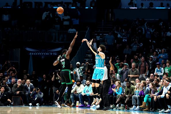 CHARLOTTE, NORTH CAROLINA - NOVEMBER 20: LaMelo Ball #1 of the Charlotte Hornets shoots the ball over Jaylen Brown #7 of the Boston Celtics during the second half of an NBA game at Spectrum Center on November 20, 2023 in Charlotte, North Carolina. NOTE TO USER: User expressly acknowledges and agrees that, by downloading and or using this photograph, User is consenting to the terms and conditions of the Getty Images License Agreement. (Photo by David Jensen/Getty Images)