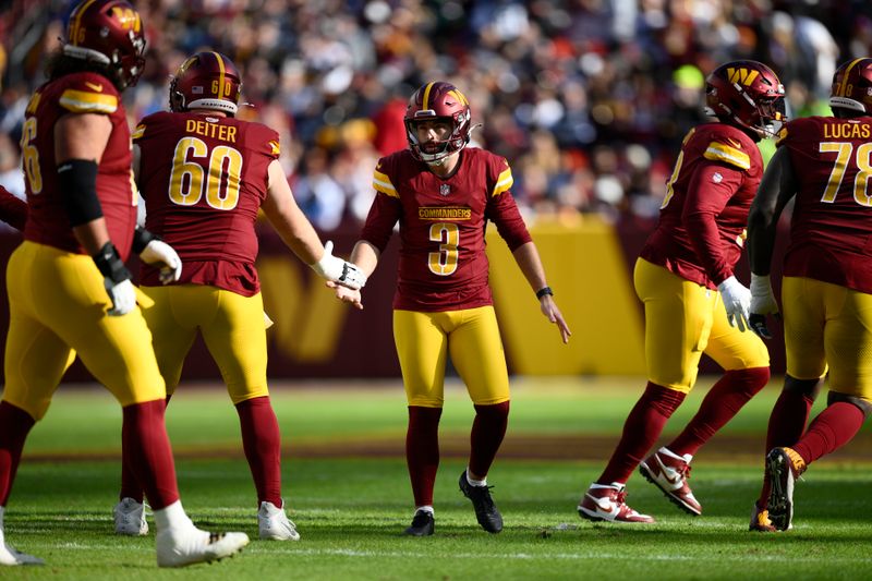 Washington Commanders place kicker Austin Seibert (3) celebrates after kicking a 41-yard field goal during the first half of an NFL football game against the Dallas Cowboys, Sunday, Nov. 24, 2024, in Landover, Md. (AP Photo/Nick Wass)