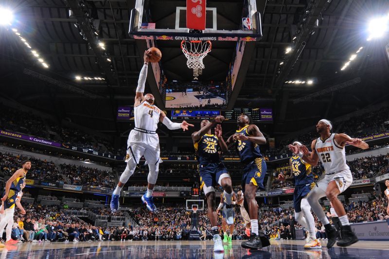 INDIANAPOLIS, IN - FEBRUARY 24:  Russell Westbrook #4 of the Denver Nuggets drives to the basket during the game against the Indiana Pacers on February 24, 2025 at Gainbridge Fieldhouse in Indianapolis, Indiana. NOTE TO USER: User expressly acknowledges and agrees that, by downloading and or using this Photograph, user is consenting to the terms and conditions of the Getty Images License Agreement. Mandatory Copyright Notice: Copyright 2025 NBAE (Photo by Ron Hoskins/NBAE via Getty Images)