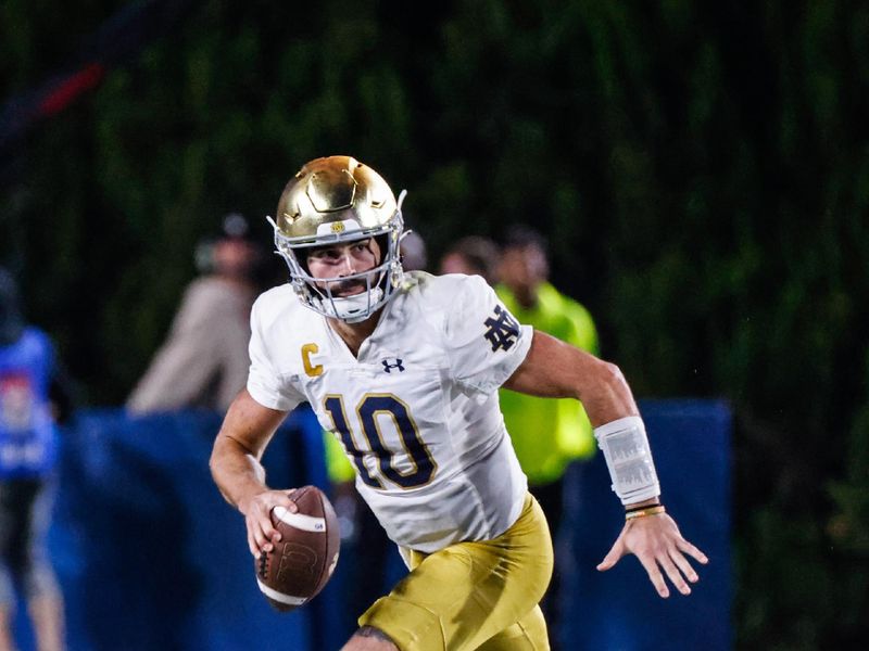 Sep 30, 2023; Durham, North Carolina, USA; Notre Dame Fighting Irish quarterback Sam Hartman (10) runs with the ball during the 2nd half of the game against Duke Blue Devils at Wallace Wade Stadium. Mandatory Credit: Jaylynn Nash-USA TODAY Sports