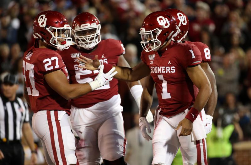 Nov 9, 2019; Norman, OK, USA; Oklahoma Sooners quarterback Jalen Hurts (1) celebrates with fullback Jeremiah Hall (27) after scoring a touchdown during the first quarter against the Iowa State Cyclones at Gaylord Family - Oklahoma Memorial Stadium. Mandatory Credit: Kevin Jairaj-USA TODAY Sports