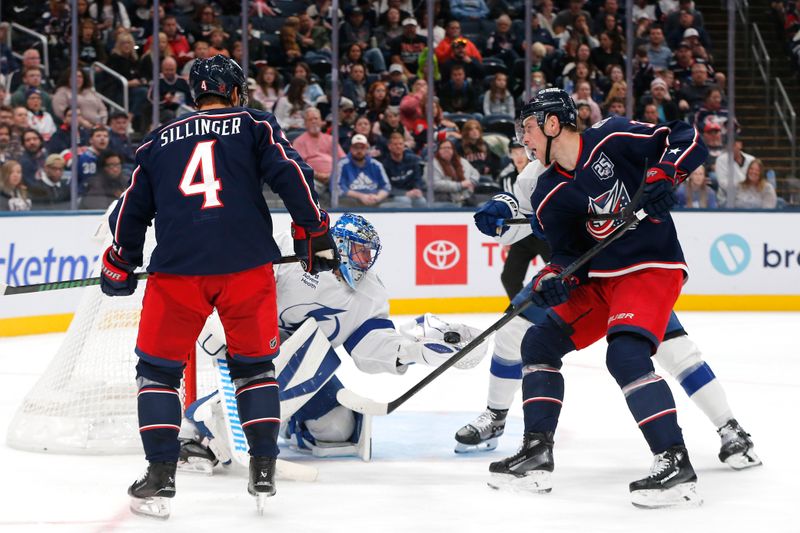Oct 18, 2025; Columbus, Ohio, USA; Tampa Bay Lightning goalie Jonas Johansson (31) makes a glove save as Columbus Blue Jackets center Charlie Coyle (3) looks on during the second period at Nationwide Arena. Mandatory Credit: Russell LaBounty-Imagn Images