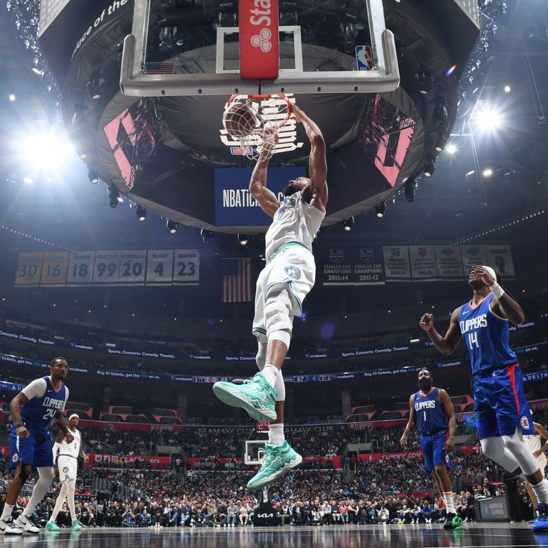 LOS ANGELES, CA - MARCH 12: Rudy Gobert #27 of the Minnesota Timberwolves dunks the ball during the game against the LA Clippers on March 12, 2024 at Crypto.Com Arena in Los Angeles, California. NOTE TO USER: User expressly acknowledges and agrees that, by downloading and/or using this Photograph, user is consenting to the terms and conditions of the Getty Images License Agreement. Mandatory Copyright Notice: Copyright 2024 NBAE (Photo by Tyler Ross/NBAE via Getty Images)