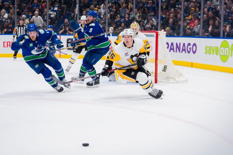 Feb 27, 2024; Vancouver, British Columbia, CAN; Vancouver Canucks forward Brock Boeser (6) aand Pittsburgh Penguins forward Noel Acciari (55) pursue the loose puck in the third period at Rogers Arena. Penguins won 4-3 in overtime. Mandatory Credit: Bob Frid-USA TODAY Sports