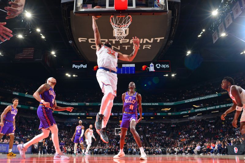 PHOENIX, AZ - NOVEMBER 20: Karl-Anthony Towns #32 of the New York Knicks drives to the basket during the game against the Phoenix Suns on November 20, 2024 at Footprint Center in Phoenix, Arizona. NOTE TO USER: User expressly acknowledges and agrees that, by downloading and or using this photograph, user is consenting to the terms and conditions of the Getty Images License Agreement. Mandatory Copyright Notice: Copyright 2024 NBAE (Photo by Kate Frese/NBAE via Getty Images)