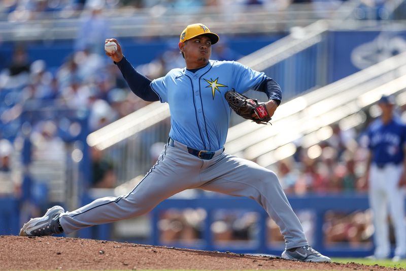 Feb 28, 2024; Dunedin, Florida, USA;  Tampa Bay Rays relief pitcher Manuel Rodriguez (39) throws a pitch against the Toronto Blue Jays in the fifth inning at TD Ballpark. Mandatory Credit: Nathan Ray Seebeck-USA TODAY Sports