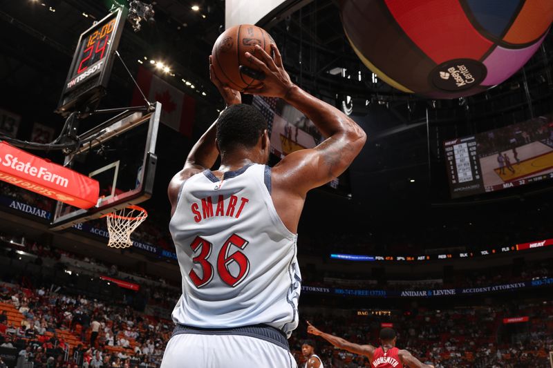 MIAMI, FL - MARCH 3:  Marcus Smart #36 of the Washington Wizards looks to pass the ball during the game against the Miami Heat on March 3, 2025 at Kaseya Center in Miami, Florida. NOTE TO USER: User expressly acknowledges and agrees that, by downloading and or using this Photograph, user is consenting to the terms and conditions of the Getty Images License Agreement. Mandatory Copyright Notice: Copyright 2025 NBAE (Photo by Issac Baldizon/NBAE via Getty Images)