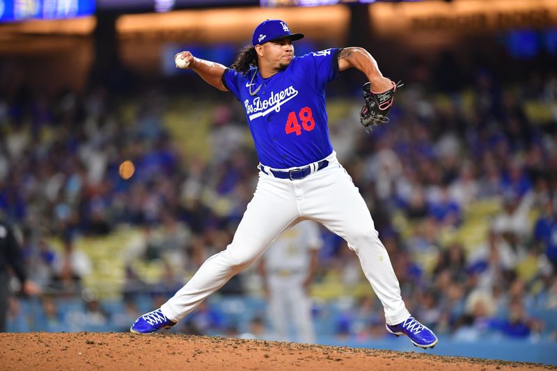 Jul 6, 2023; Los Angeles, California, USA; Los Angeles Dodgers relief pitcher Brusdar Graterol (48) throws against the Pittsburgh Pirates during the eighth inning at Dodger Stadium. Mandatory Credit: Gary A. Vasquez-USA TODAY Sports