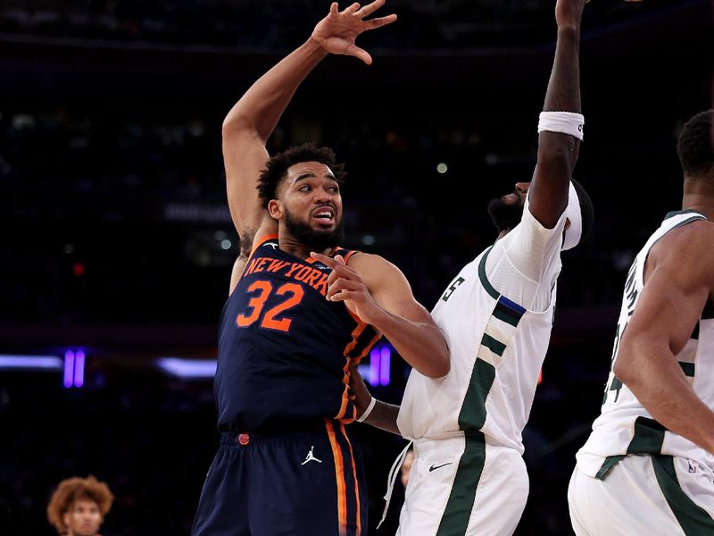 NEW YORK, NEW YORK - NOVEMBER 08:  Karl-Anthony Towns #32 of the New York Knicks passes the ball as Bobby Portis #9 of the Milwaukee Bucks defends at Madison Square Garden on November 08, 2024 in New York City. NOTE TO USER: User expressly acknowledges and agrees that, by downloading and or using this photograph, User is consenting to the terms and conditions of the Getty Images License Agreement. (Photo by Elsa/Getty Images)