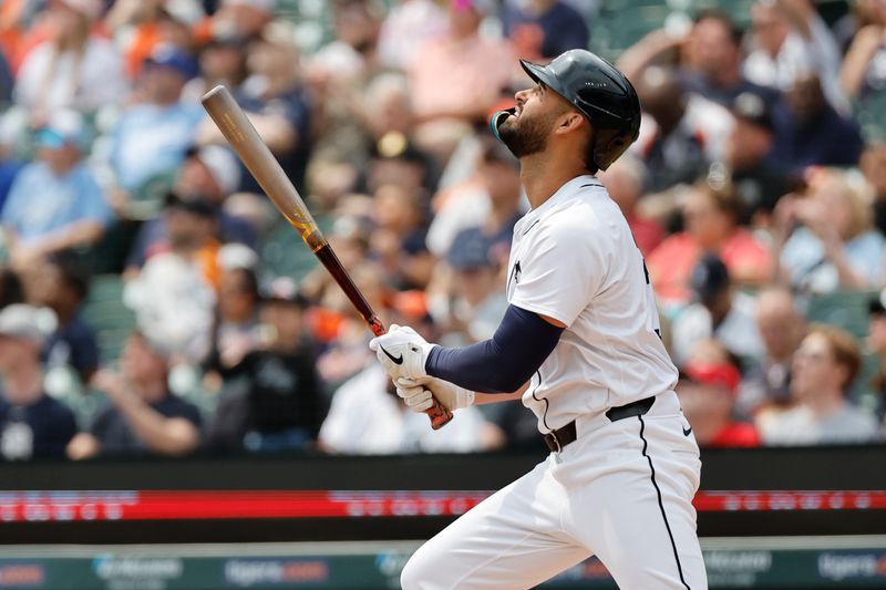 Apr 28, 2024; Detroit, Michigan, USA;  Detroit Tigers left fielder Riley Greene (31) hits a sacrifice fly to score a run in the second inning against the Kansas City Royals at Comerica Park. Mandatory Credit: Rick Osentoski-USA TODAY Sports