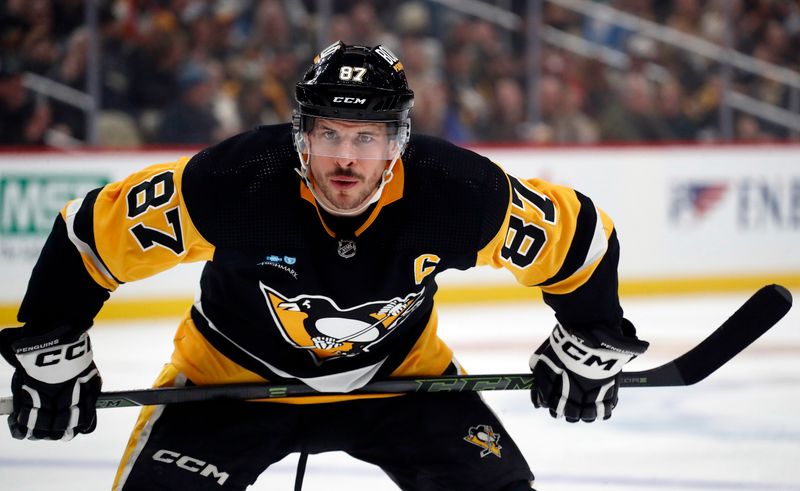 Apr 6, 2024; Pittsburgh, Pennsylvania, USA;  Pittsburgh Penguins center Sidney Crosby (87) prepares to take a face-off against the Tampa Bay Lightning during the first period at PPG Paints Arena. Mandatory Credit: Charles LeClaire-USA TODAY Sports