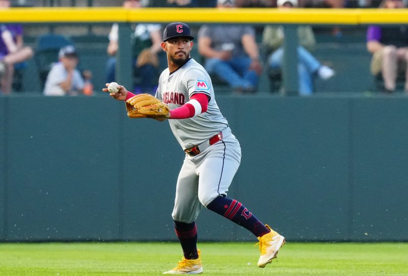 May 29, 2024; Denver, Colorado, USA; Cleveland Guardians third base Gabriel Arias (13) fields the ball in the first inning against the Colorado Rockies at Coors Field. Mandatory Credit: Ron Chenoy-USA TODAY Sports