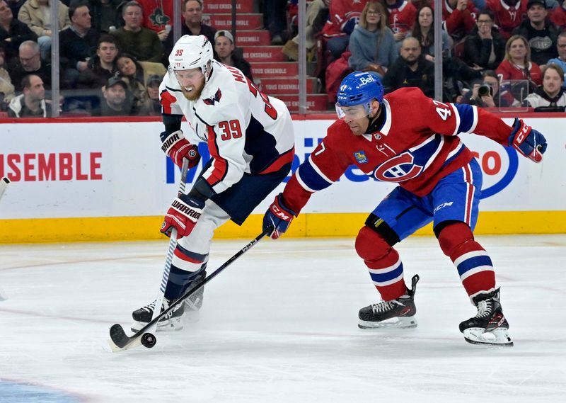 Feb 17, 2024; Montreal, Quebec, CAN; Washington Capitals forward Anthony Mantha (39) plays the puck and Montreal Canadiens defenseman Jayden Struble (47) defends during the third period at the Bell Centre. Mandatory Credit: Eric Bolte-USA TODAY Sports