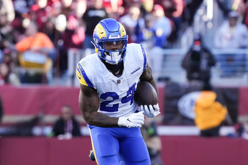 Los Angeles Rams running back Royce Freeman (24) runs the ball during an NFL football game against the San Francisco 49ers in Santa Clara, Calif., Sunday, Jan. 7, 2024. (AP Photo/Loren Elliott)