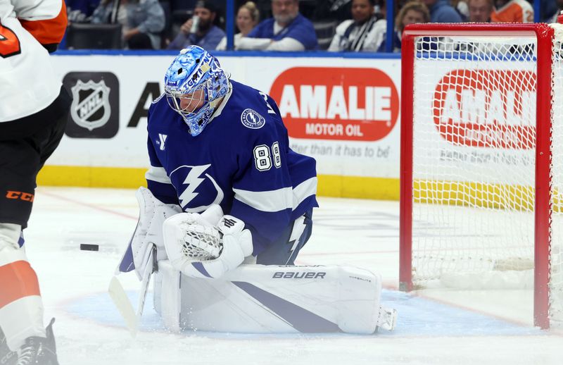 Mar 17, 2025; Tampa, Florida, USA;  Tampa Bay Lightning goaltender Andrei Vasilevskiy (88) makes a save against the Philadelphia Flyers during the second period at Amalie Arena. Mandatory Credit: Kim Klement Neitzel-Imagn Images