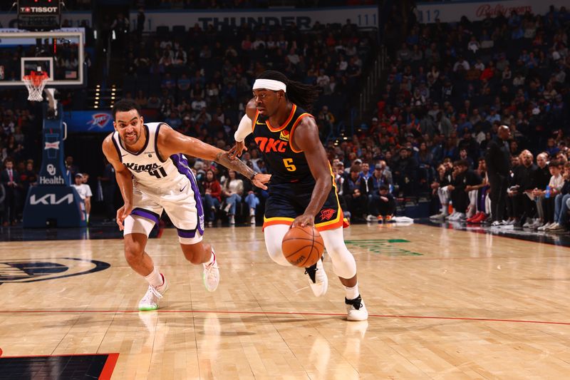 OKLAHOMA CITY, OK - FEBRUARY 11: Luguentz Dort #5 of the Oklahoma City Thunder dribbles the ball during the game against the Sacramento Kings on February 11, 2024 at Paycom Arena in Oklahoma City, Oklahoma. NOTE TO USER: User expressly acknowledges and agrees that, by downloading and or using this photograph, User is consenting to the terms and conditions of the Getty Images License Agreement. Mandatory Copyright Notice: Copyright 2024 NBAE (Photo by Zach Beeker/NBAE via Getty Images)