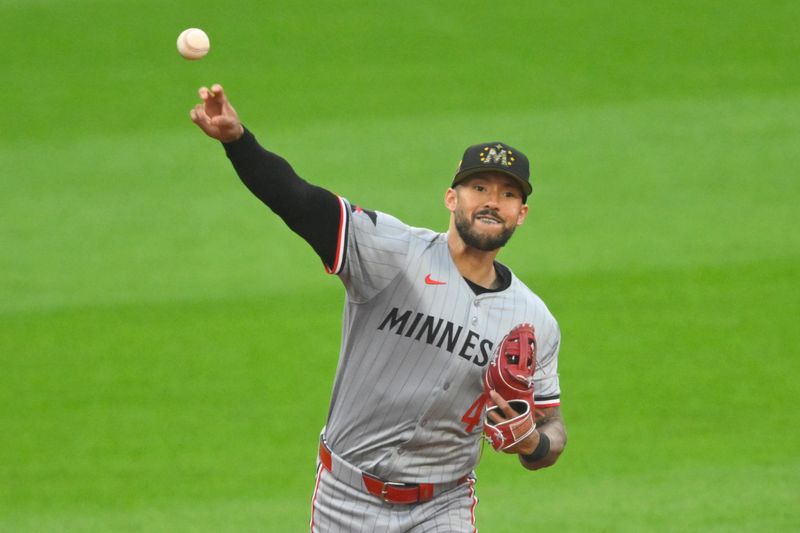 May 17, 2024; Cleveland, Ohio, USA; Minnesota Twins shortstop Carlos Correa (4) throws to first base in the third inning against the Cleveland Guardians at Progressive Field. Mandatory Credit: David Richard-USA TODAY Sports