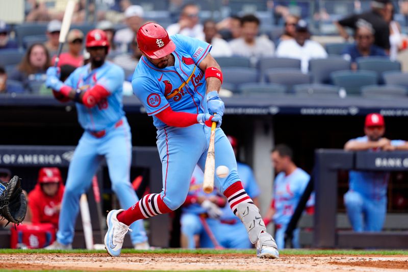 Aug 31, 2024; Bronx, New York, USA; St. Louis Cardinals third baseman Nolan Arenado (28) hits a single against the New York Yankees during the third inning at Yankee Stadium. Mandatory Credit: Gregory Fisher-USA TODAY Sports