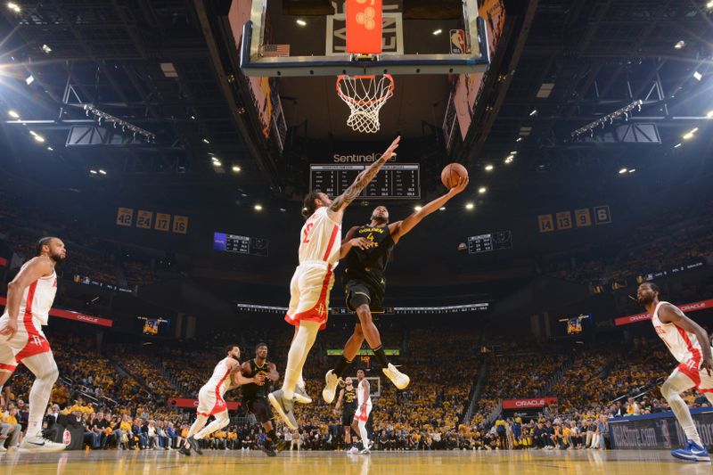 SAN FRANCISCO, CA - MAY 2: Moses Moody #4 of the Golden State Warriors drives to the basket during the game against the Houston Rockets during Round 1 Game 6 of the 2025 NBA Playoffs on May 2, 2025 at Chase Center in San Francisco, California. NOTE TO USER: User expressly acknowledges and agrees that, by downloading and or using this photograph, user is consenting to the terms and conditions of Getty Images License Agreement. Mandatory Copyright Notice: Copyright 2025 NBAE (Photo by Noah Graham/NBAE via Getty Images)