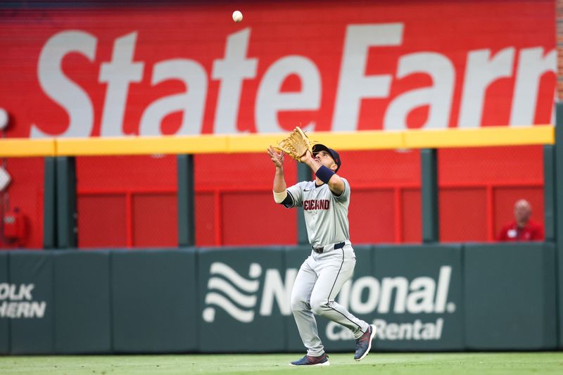 Apr 26, 2024; Atlanta, Georgia, USA; Cleveland Guardians right fielder Ramon Laureano (10) catches a fly ball against the Atlanta Braves in the first inning at Truist Park. Mandatory Credit: Brett Davis-USA TODAY Sports